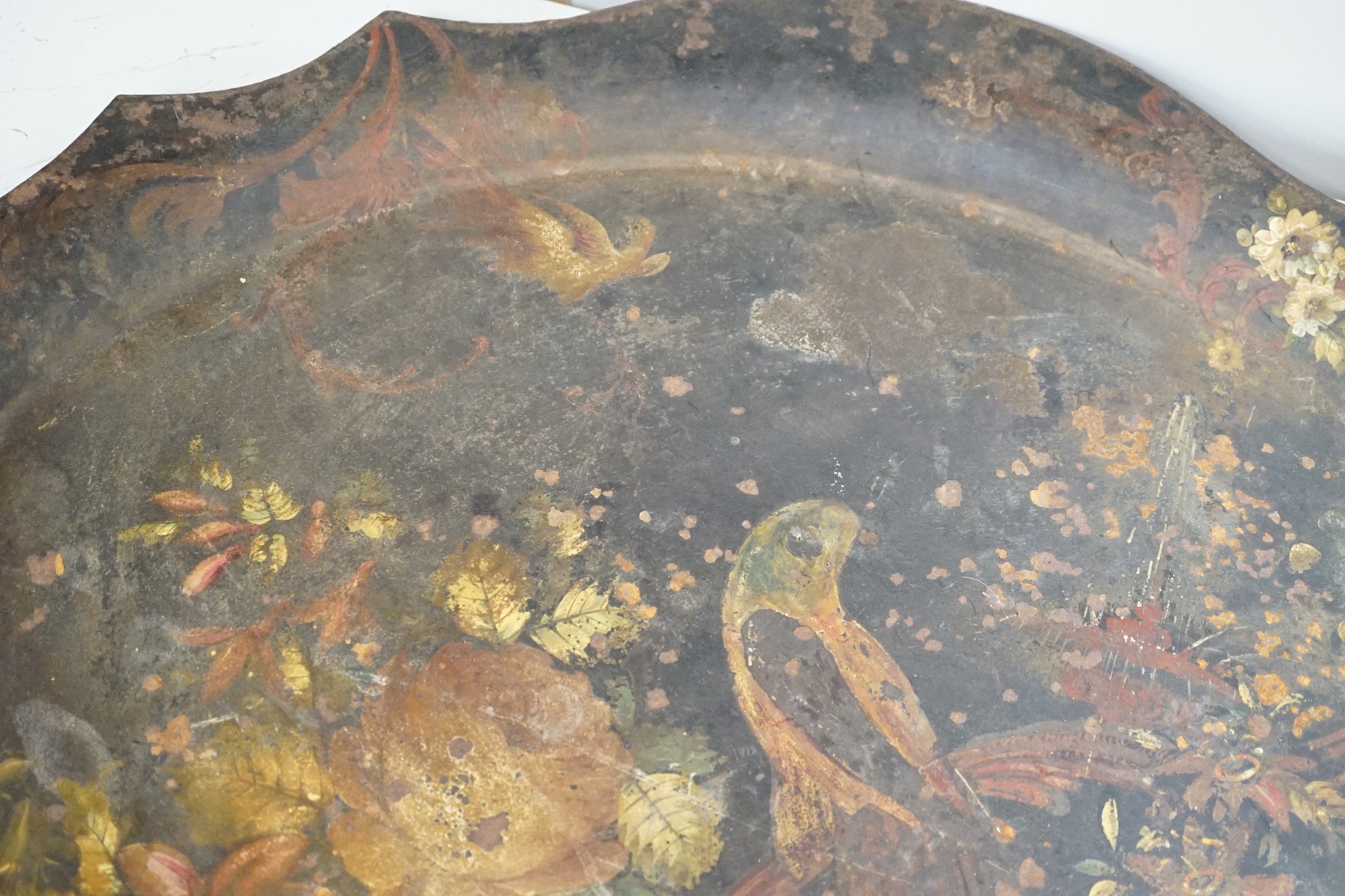 A Victorian painted iron tray with parrot and flower decoration. 82cm wide